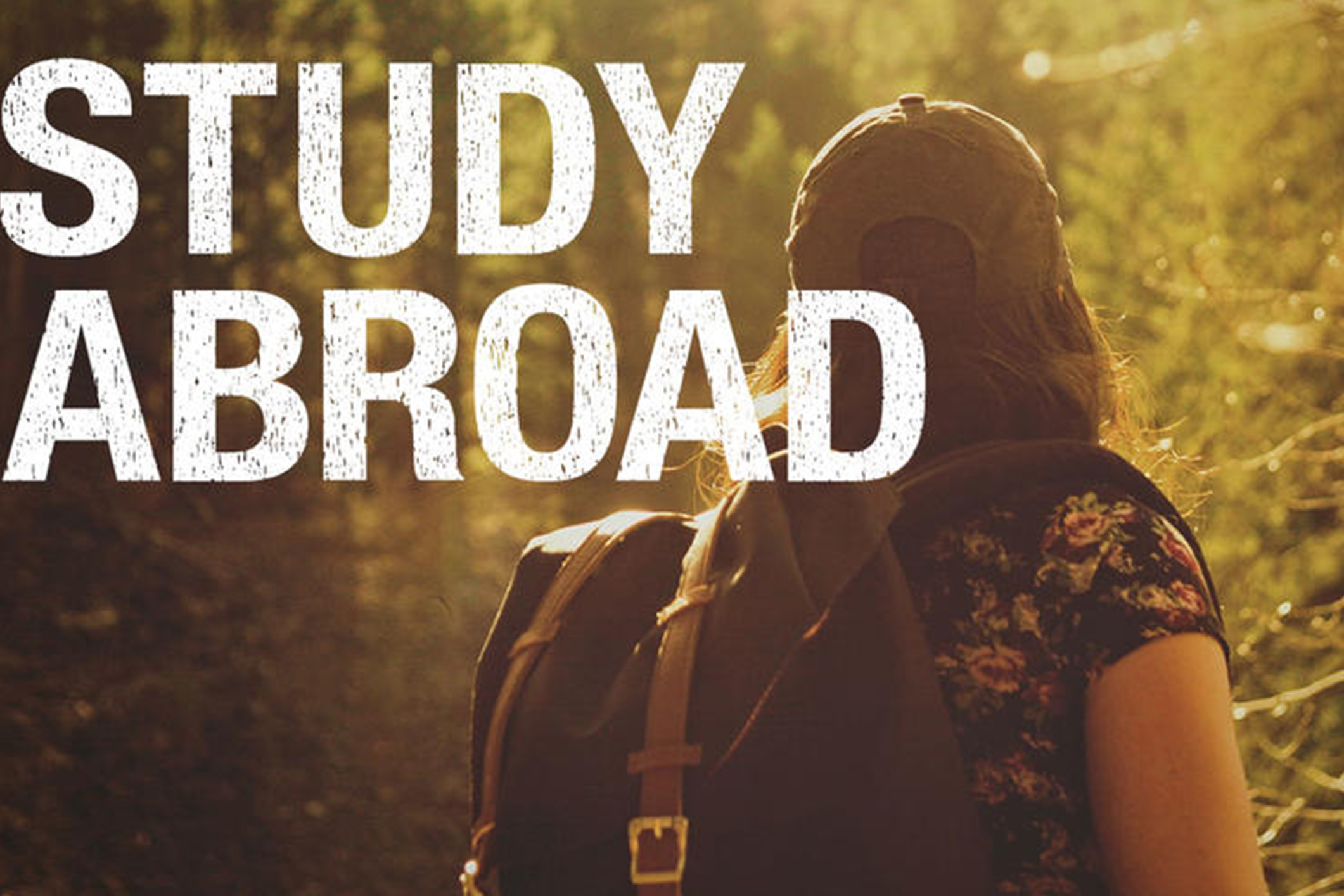 Student hiking with words Study Abroad