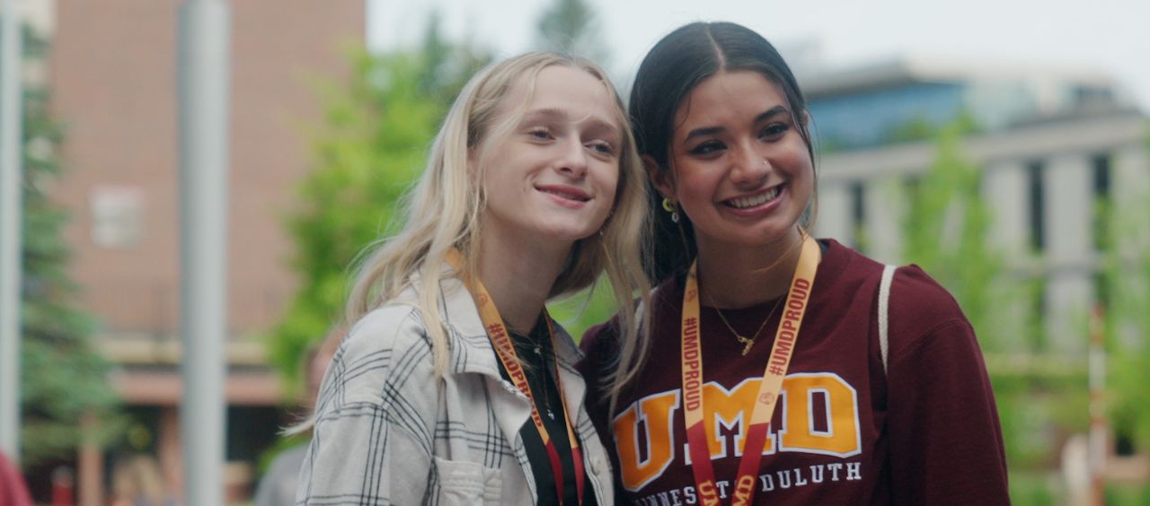 Two happy students pose for a photo at UMD Orientation
